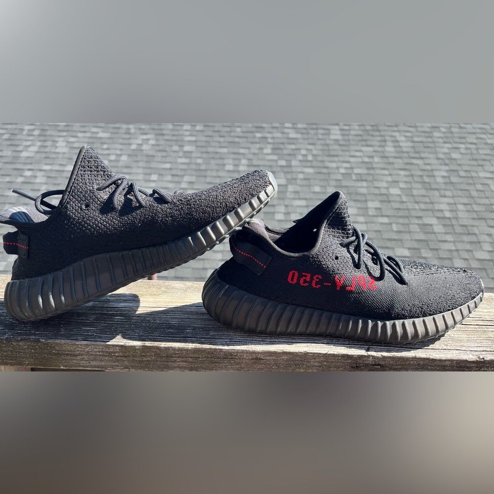 Yeezy Black and Red Athletic Shoes